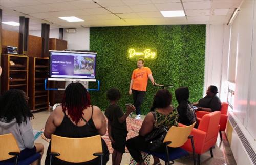 man talking to people about credit union services